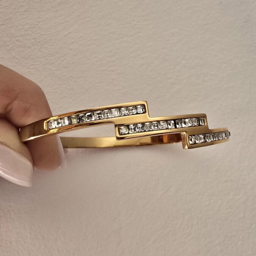 Steel bracelet in rose gold color with decorative stones, like new