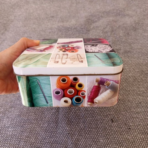 Sewing kit metal box with useful sewing items used