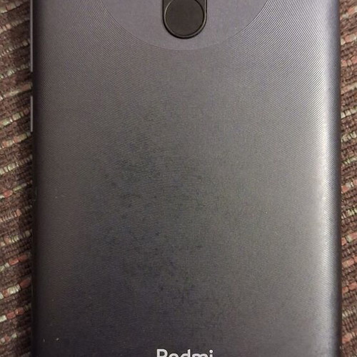Xiaomi 9 smartphone with screen protector and case, gray