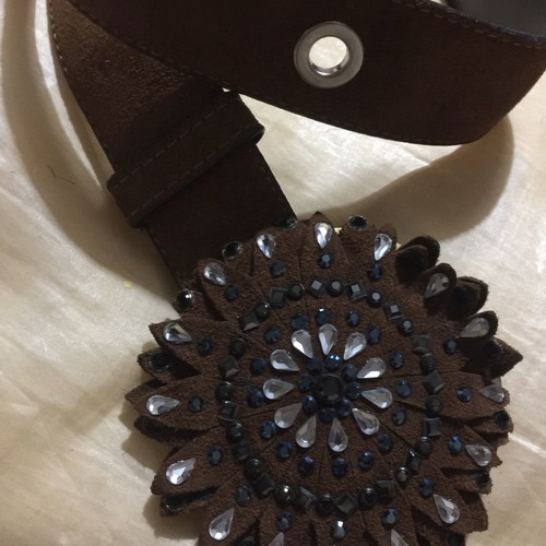 Wide brown suede belt with large buckle and white blue stones