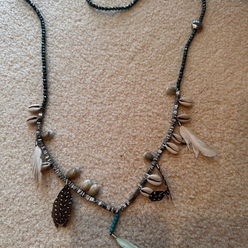 Long handmade necklace like new with shells and feathers green