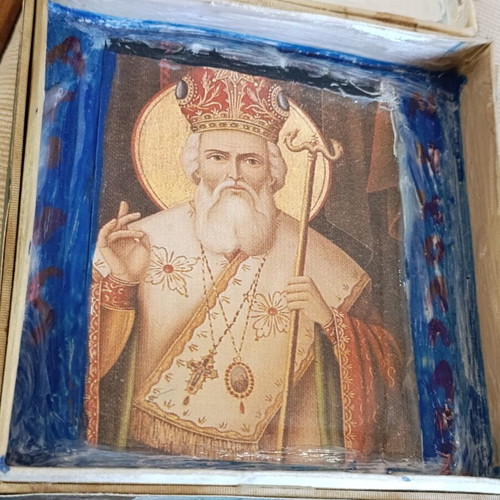Cardboard box with silk-screened religious icon on canvas