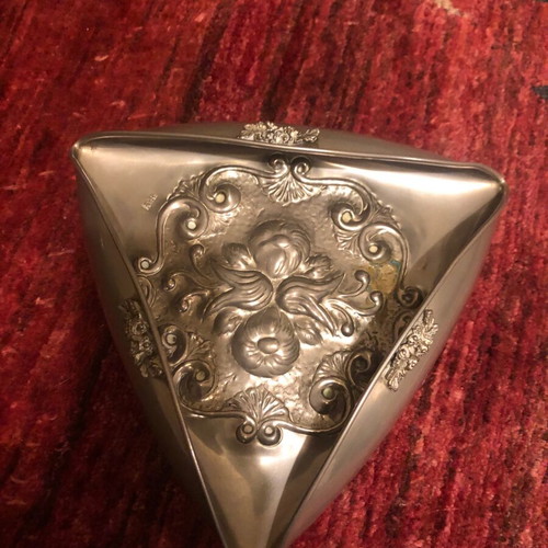 Decorative triangular vessel used with embossed flowers