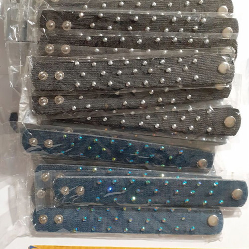 Pack of 135 denim and faux leather bracelets with rhinestones