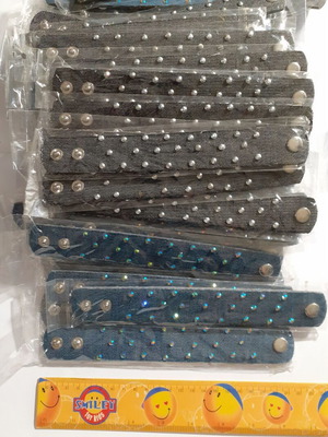 Pack of 135 denim and faux leather bracelets with rhinestones