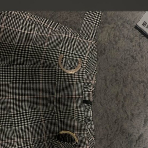Skort used black and white plaid with silver buckles and pink detail