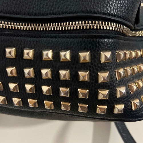 Black backpack used with studs