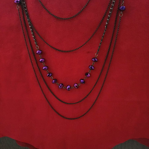 Long necklace new with black chains and purple crystals