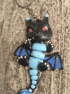 Pokemon Black Charizard Keychain like new with movement