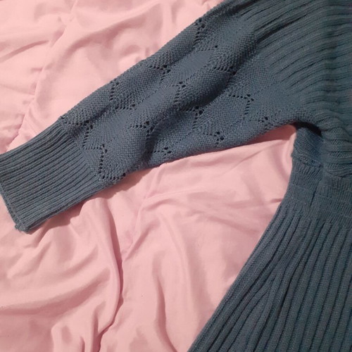 Knitted blue dress new with perforated sleeve designs and back opening size M