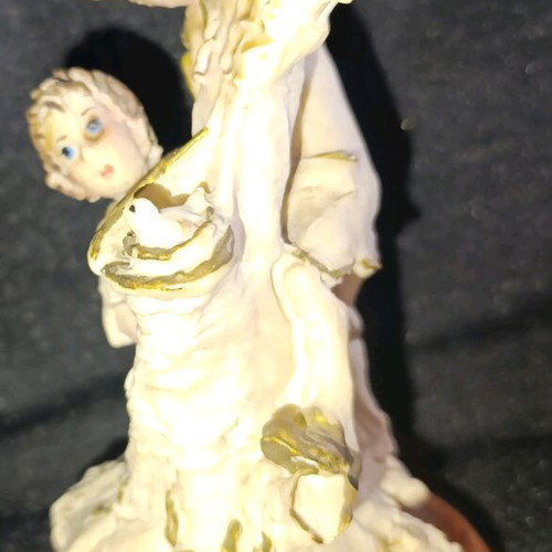 Vintage decorative figurine with children, used