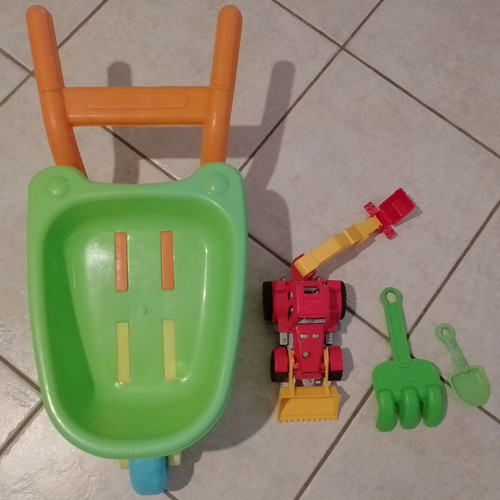 Beach toy set: plastic wheelbarrow, shovel, rake, small excavator