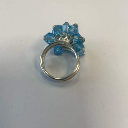 3D ring with bright blue moving crystals like new