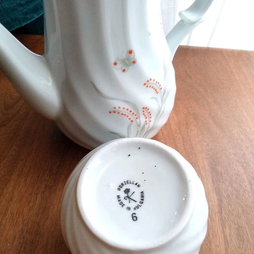 Porcelain teapot and creamer set like new with embossed designs