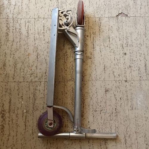 Silver metal scooter used, lightweight and foldable