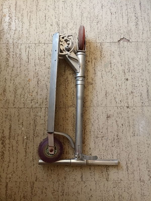 Silver metal scooter used, lightweight and foldable