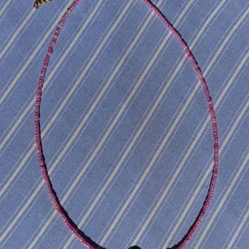 Necklace new, steel wire with pink and gold glass beads and pearl