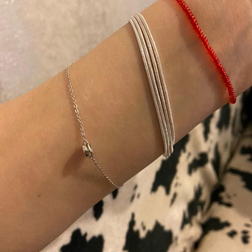 Pandora s925Ale Reflexions bracelet with four strands.