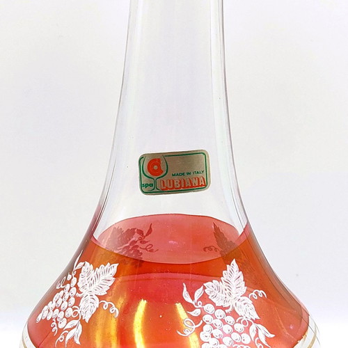 Italian glass decanter with glasses used, red with gold details