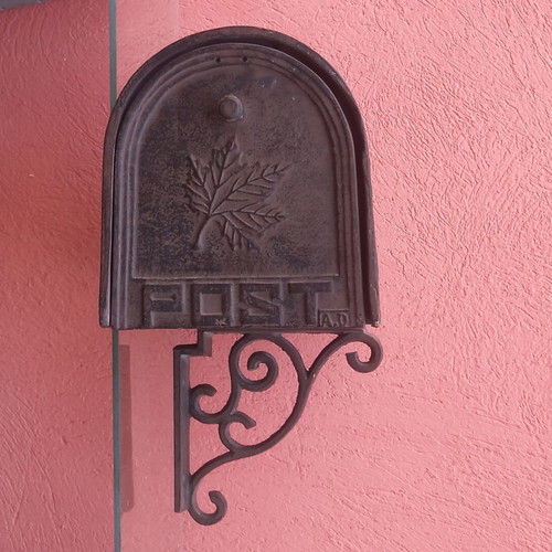 Cast iron mailbox used with metal base for wall or pole mounting