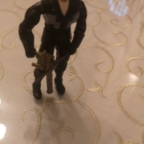 G.I. Joe action figure with weapons