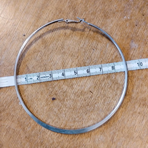 Hoop earring used, gold color, single piece