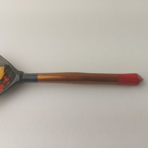 Old painted wooden spoon used