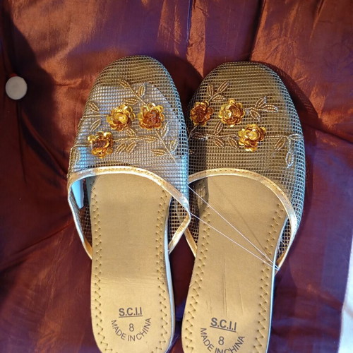Slippers new, gold color
