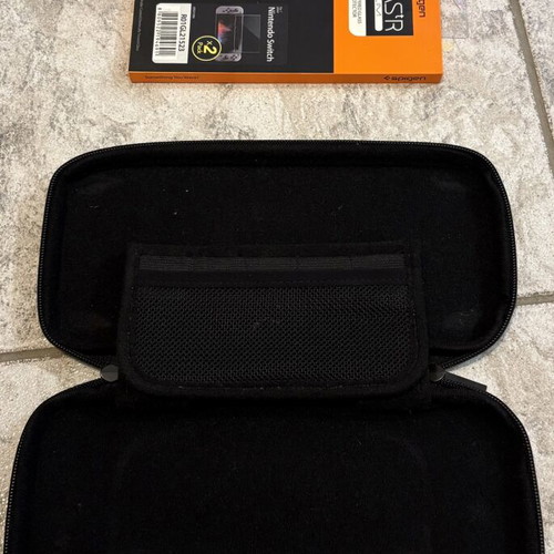 Nintendo Switch protection set used with original carrying case and Spigen tempered glass