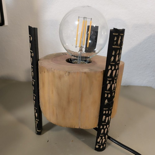 Handmade table lamp from solid wood trunk with carved black legs