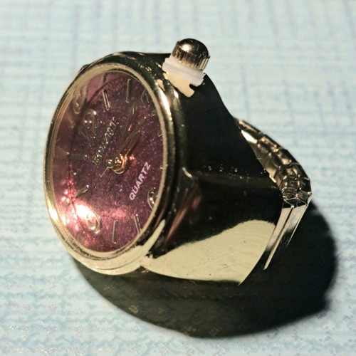 Quartz ring watch like new with purple dial and gold bracelet