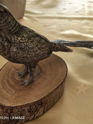 Decorative metal bird on wooden base vintage like new