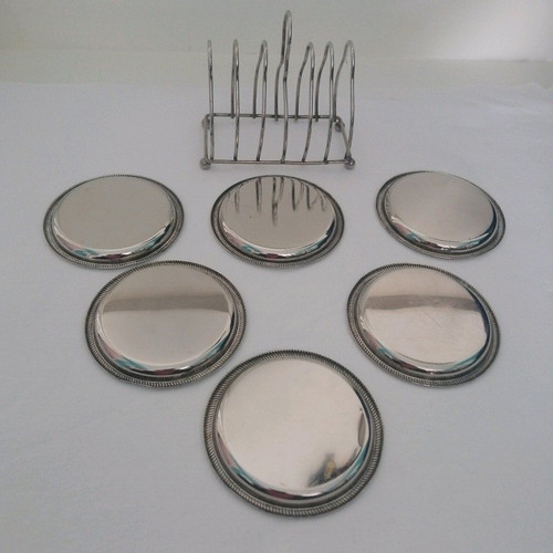 Vintage silver coaster set with elegant stand, like new