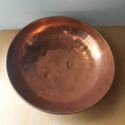 Large copper bowl used with carved details
