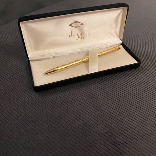 Elegant pen like new in gold tone with blue ink