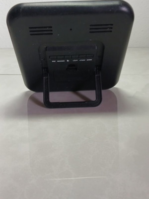 Digital table clock used with temperature display