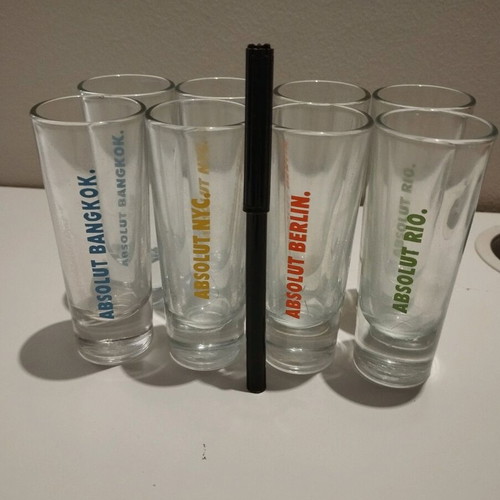 Absolut collectible shot glasses set of 8 like new