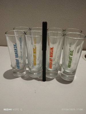 Absolut collectible shot glasses set of 8 like new