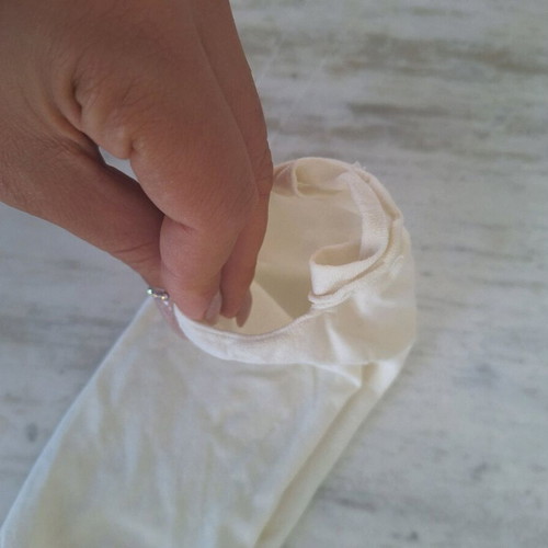 White fabric face mask used with filter pocket