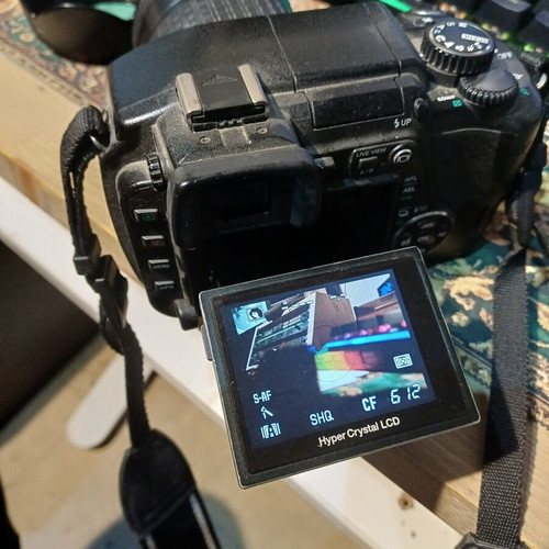 Olympus E-330 DSLR camera used with Zuiko Digital 14-45mm lens