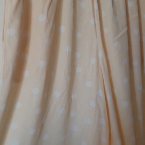 Women's palazzo pants like new, pale yellow with white polka dots