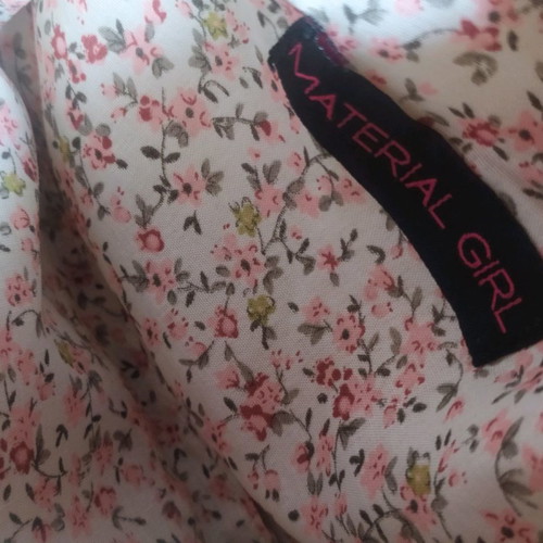 Material Girl crossbody bag used with sequins camouflage design