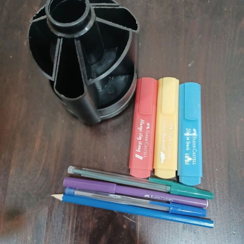 Rotating plastic pencil holder like new with contents