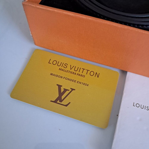 Louis Vuitton leather belt with interchangeable buckles