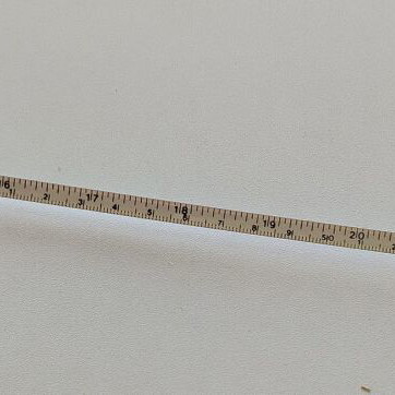 Measuring tape used in centimeters and inches, unknown origin
