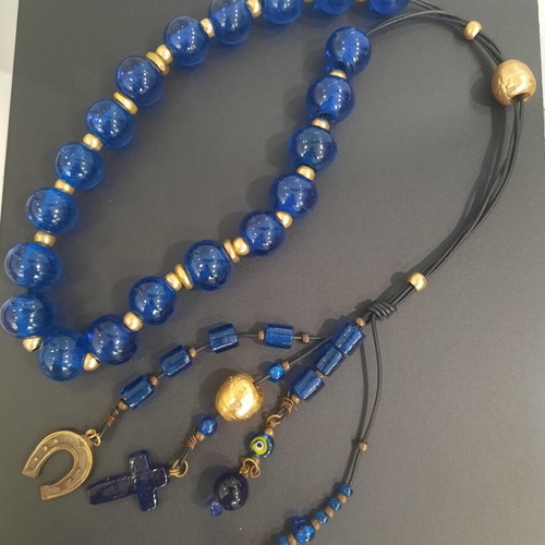 Decorative komboloi with large blue glass beads used, leather, bronze accents