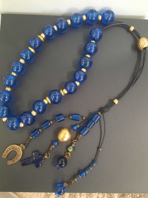 Decorative komboloi with large blue glass beads used, leather, bronze accents