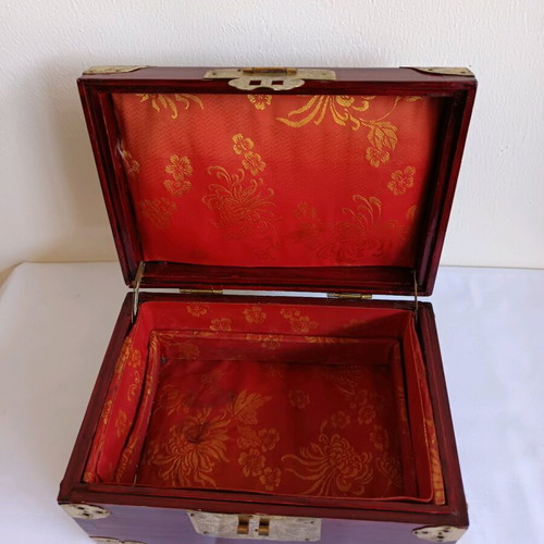 Wooden jewelry box used with brass decorative elements