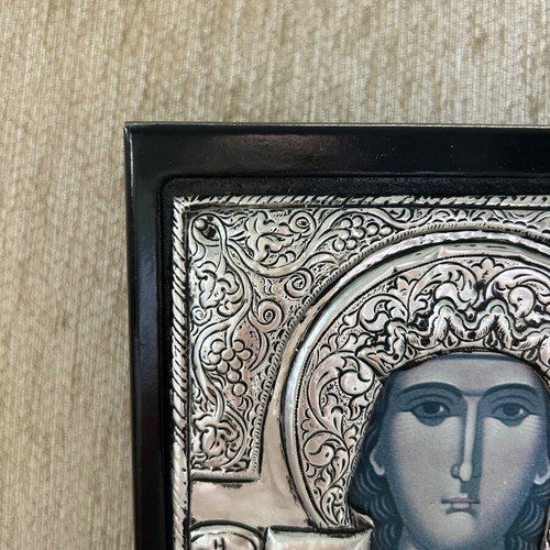 Religious icon used with metal overlay on wooden base