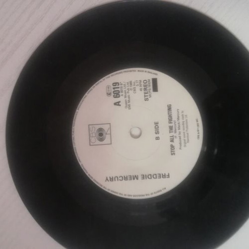 45 RPM vinyl record used with minor cover wear
